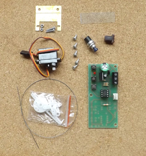 uncoupler kit contents include piano wire push button switch control board acetate servo motor with cranks bracket screws and nuts and bolts 3D printed sleeper replacement piece